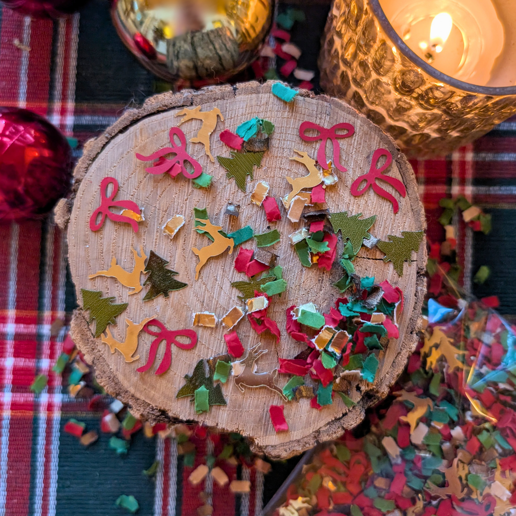 Classic Christmas confetti with reindeer trees and red bows