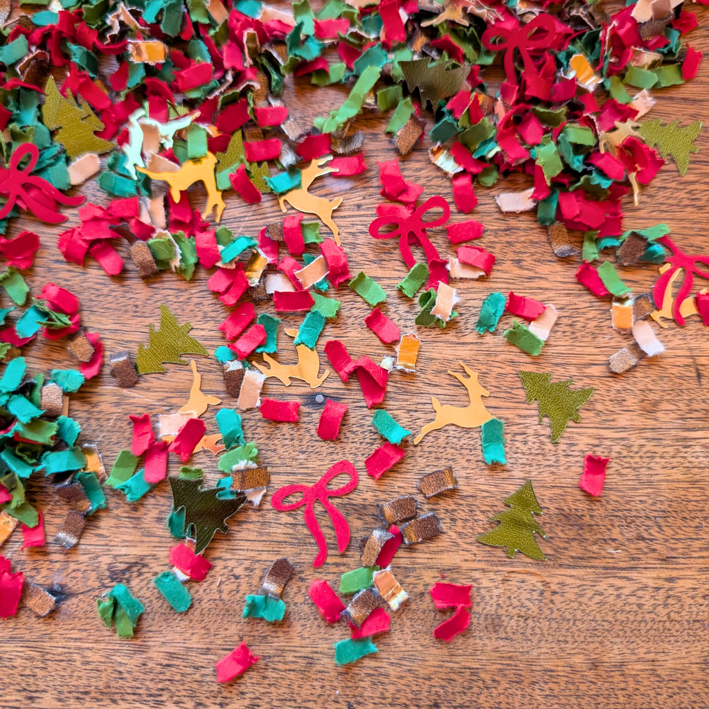 Classic Christmas confetti with reindeer trees and red bows
