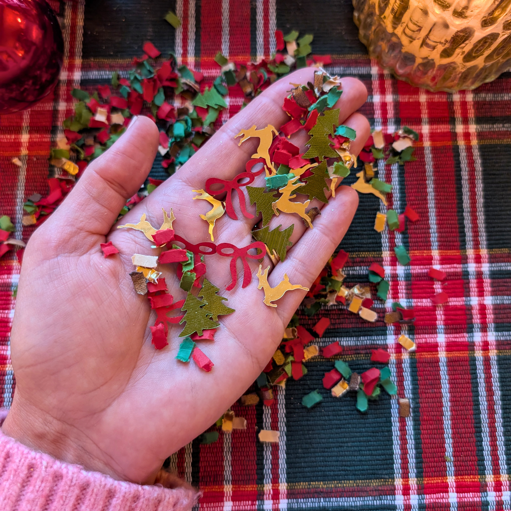 Classic Christmas confetti with reindeer trees and red bows