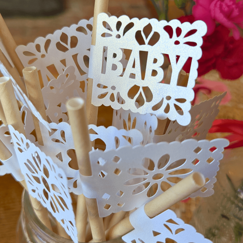 Papel picado party straws with white shimmer flags on kraft straws