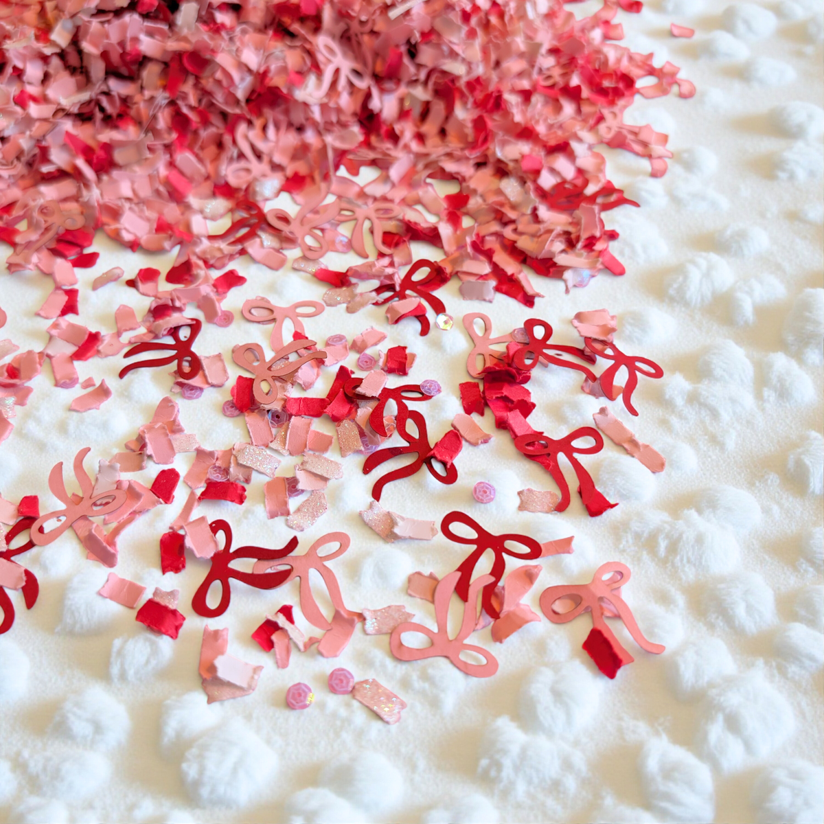 Coquette Valentine's bow confetti with red and pink bows